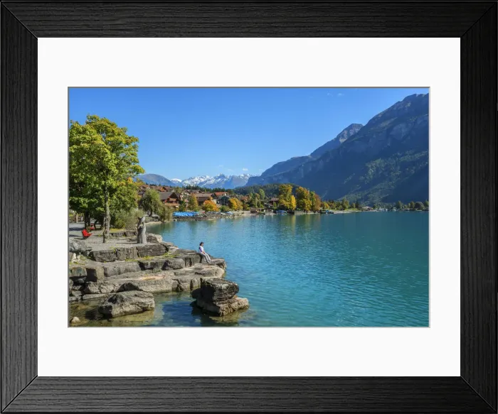 Framed Print : Woman sitting on the bank of Lake Brienz, Brienz, Berner Oberland, Switzerland Framed Print : Woman sitting on the bank of Lake Brienz, Brienz, Berner Oberland, Switzerland