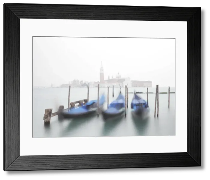 Framed Print : Gondolas moored at the Bacino di San Marco with a slightly visible Church of San Giorgio Maggiore Framed Print : Gondolas moored at the Bacino di San Marco with a slightly visible Church of San Giorgio Maggiore