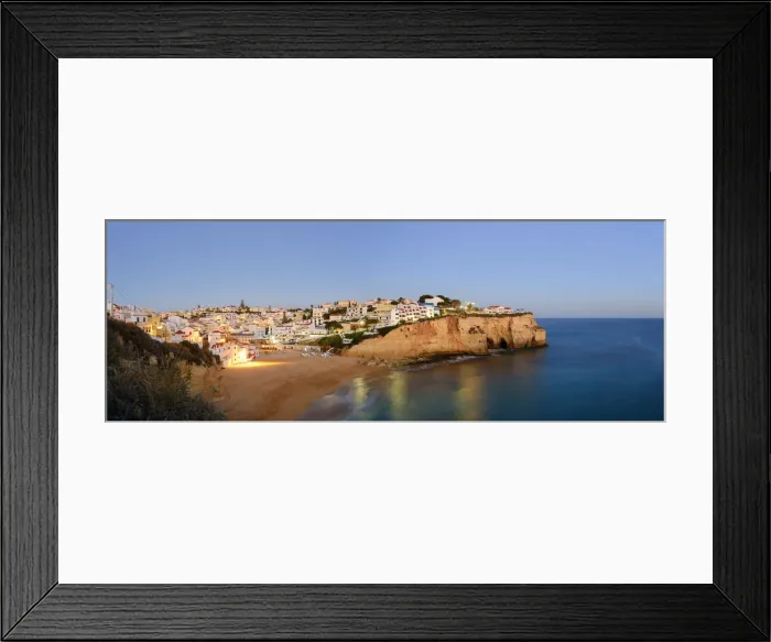 Framed Print : The beach and village of Carvoeiro at dusk. Lagoa, Algarve, Portugal