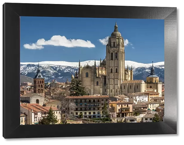 City skyline with the Gothic Cathedral and the snowy mountains of Sierra de Guadarrama