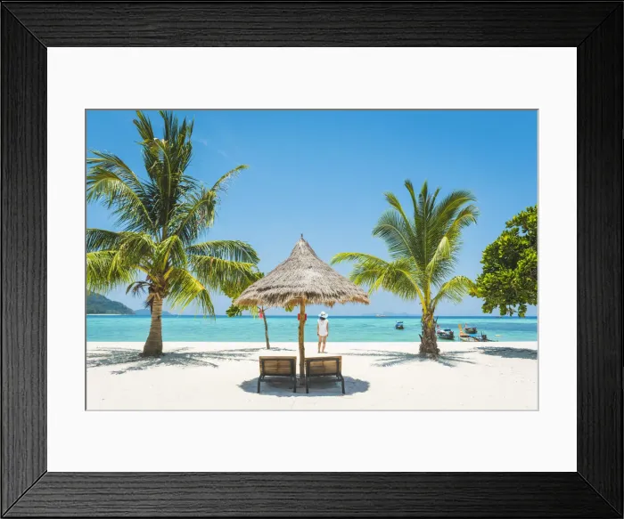 Framed Print : Ko Lipe, Satun Province, Thailand. Tourist admiring the view on a white sand beach (MR) Framed Print : Ko Lipe, Satun Province, Thailand. Tourist admiring the view on a white sand beach (MR)