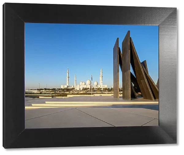 Sheikh Zayed bin Sultan Al Nahyan Grand Mosque and Wahat Al Karama Monument at sunrise
