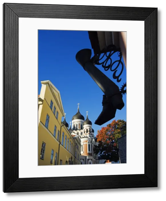 Framed Print : An Ornamental Steel Boot hangs infront of the 19th Framed Print : An Ornamental Steel Boot hangs infront of the 19th