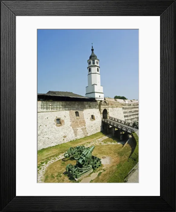 Framed Print : Clock Tower and modern Military Cannon in the Grounds Framed Print : Clock Tower and modern Military Cannon in the Grounds