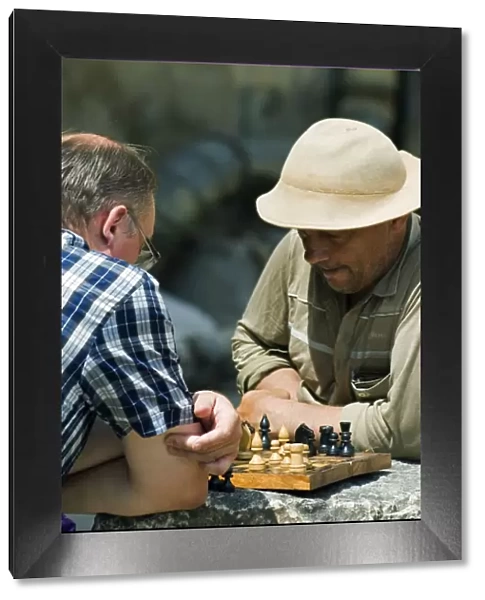 Men Playing Chess on the Street