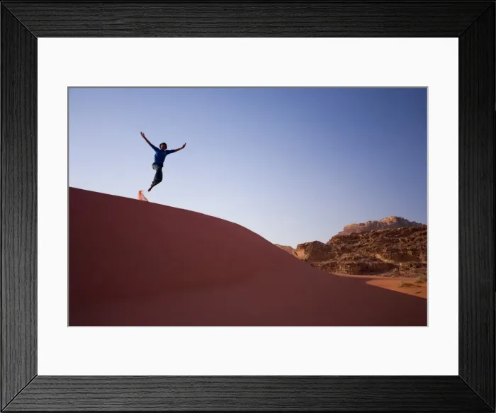 Framed Print : Person jumping off sand dune Framed Print : Person jumping off sand dune