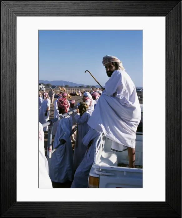 Framed Print : A bystander watches the proceedings at the start of Framed Print : A bystander watches the proceedings at the start of