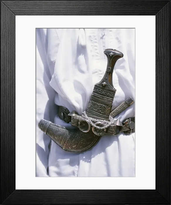 Framed Print : Omani men wear the traditional long white robes Framed Print : Omani men wear the traditional long white robes