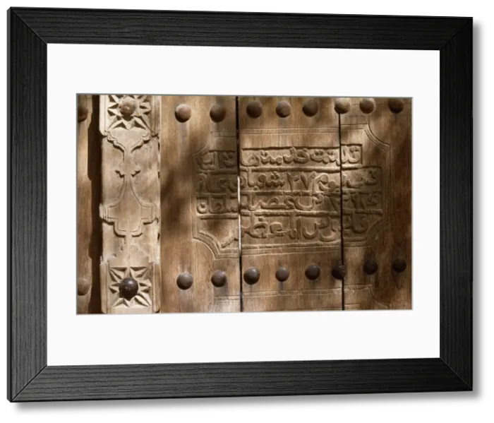 Framed Print : An inscription on the wooden door of Framed Print : An inscription on the wooden door of