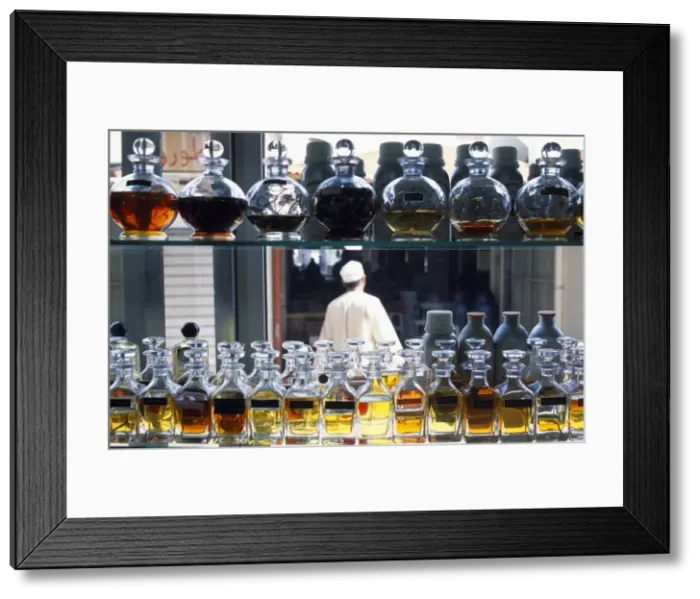 Framed Print : An Omani man walks through the incense souk in Salalah Framed Print : An Omani man walks through the incense souk in Salalah