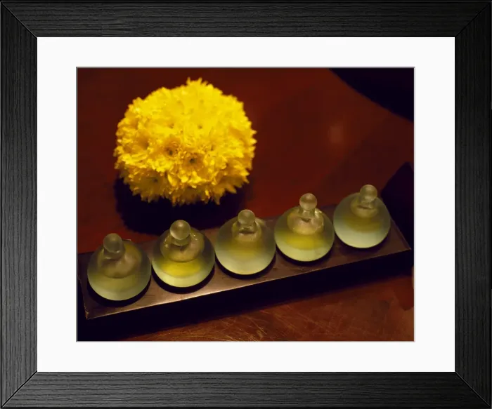 Framed Print : Bottles of scented oils in the spa of Framed Print : Bottles of scented oils in the spa of