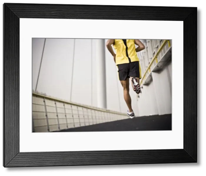 Framed Print : Man running across a bridge Framed Print : Man running across a bridge