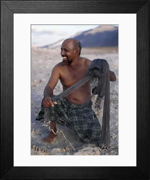 Framed Print : A fisherman near Di Hamri with his weighted throwing net