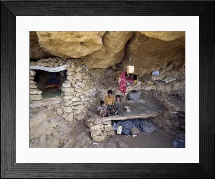 Framed Print : A spacious rock shelter dwelling of a pastoral Bedu Framed Print : A spacious rock shelter dwelling of a pastoral Bedu