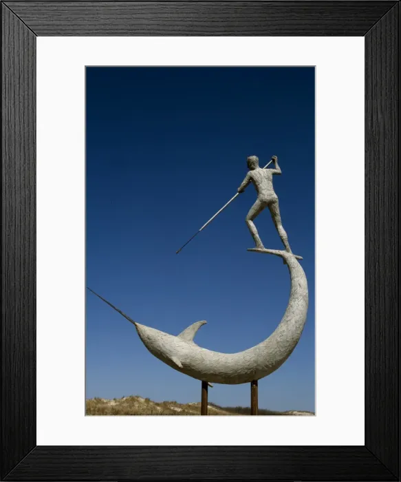 Framed Print : A statue of Narwhal being speared at Menemsha Harbour