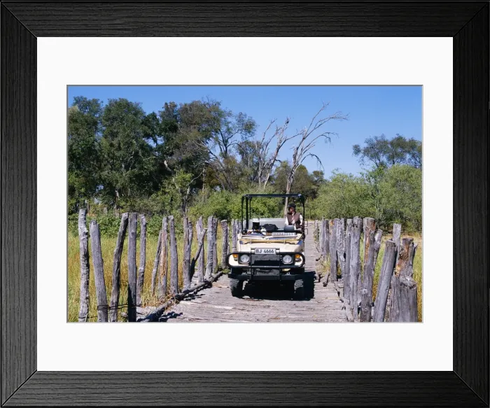Framed Print : Safari vehicle crossing the Khwai river bridge