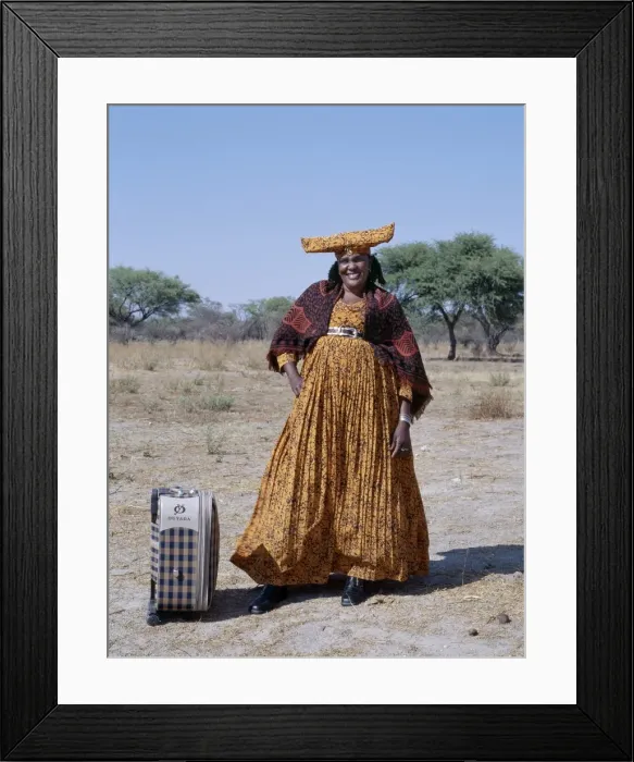 Framed Print : A smartly dressed Herero woman waits for a bus Framed Print : A smartly dressed Herero woman waits for a bus