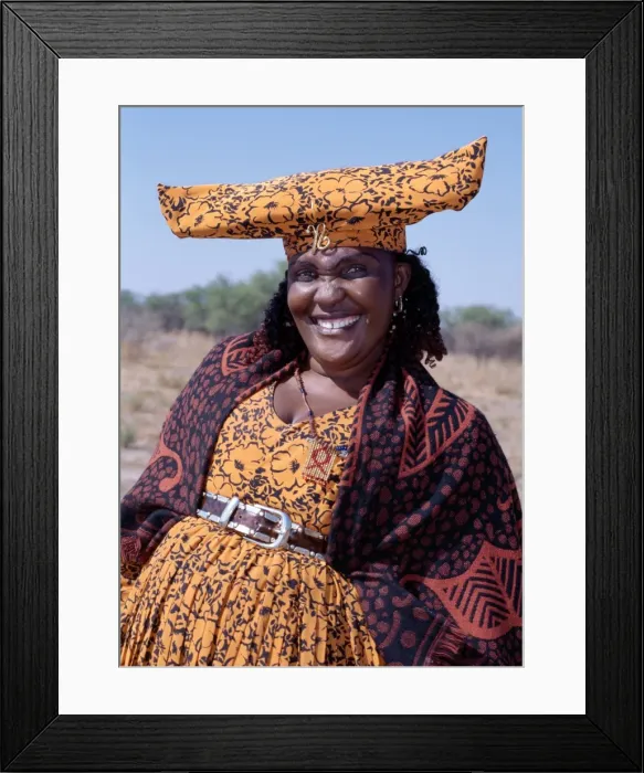 Framed Print : A smartly dressed Herero woman has a beaded AIDS badge Framed Print : A smartly dressed Herero woman has a beaded AIDS badge