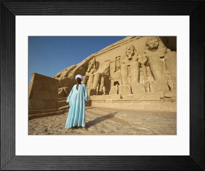 Framed Print : A temple guardian stands in front of the facade of Abu Simbel Framed Print : A temple guardian stands in front of the facade of Abu Simbel