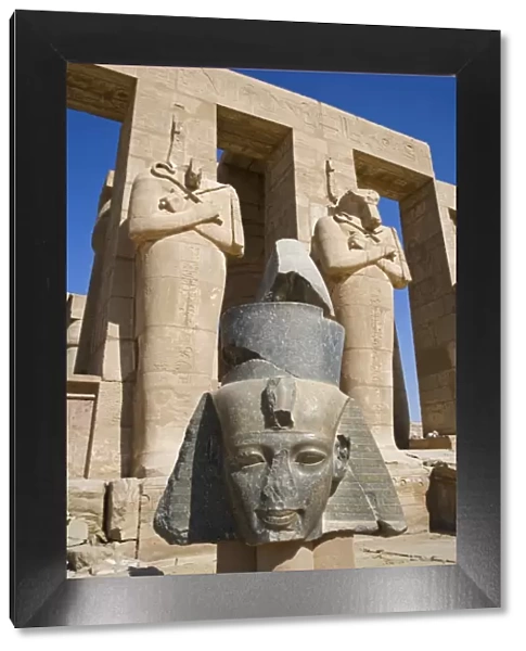 Headless statues of Ramses II line the courtyard at