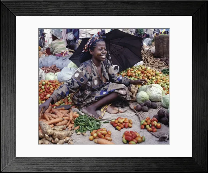 Framed Print : A woman sells vegetables at Bati market Framed Print : A woman sells vegetables at Bati market