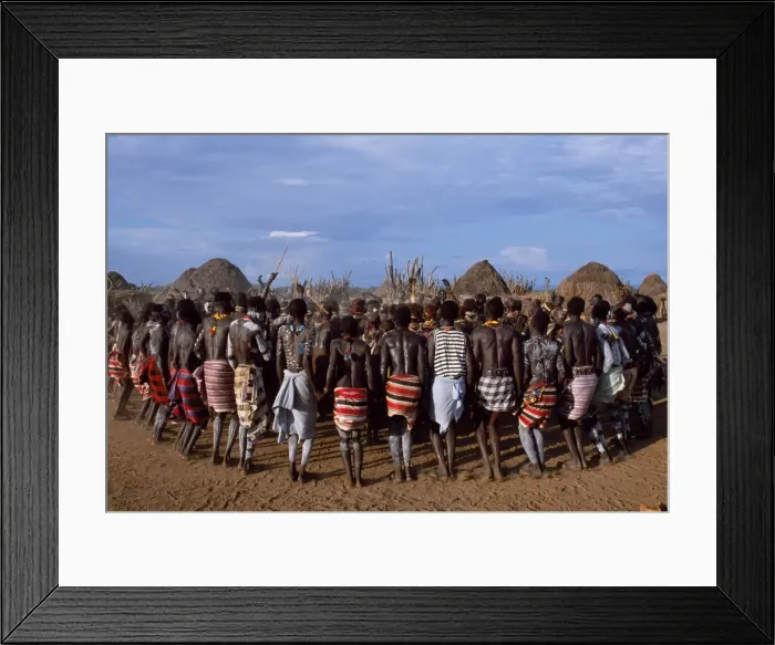 Framed Print : The men hold hands forming a circle within which Framed Print : The men hold hands forming a circle within which