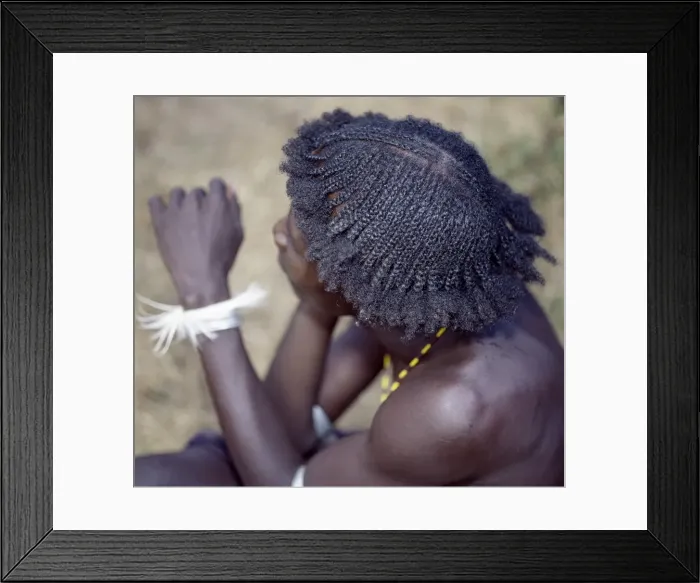Framed Print : An unusual braided hairstyle of a Dassanech young man Framed Print : An unusual braided hairstyle of a Dassanech young man