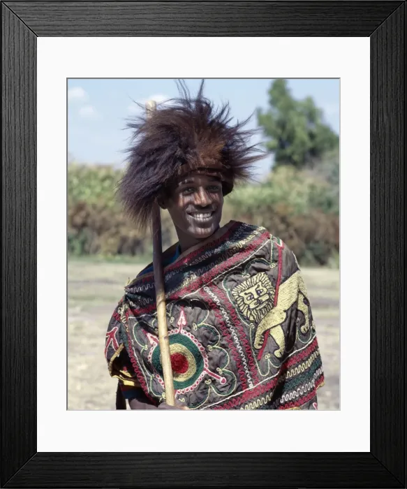 Framed Print : An Ethiopian man wears a headdress made from the skin of a gelada Framed Print : An Ethiopian man wears a headdress made from the skin of a gelada