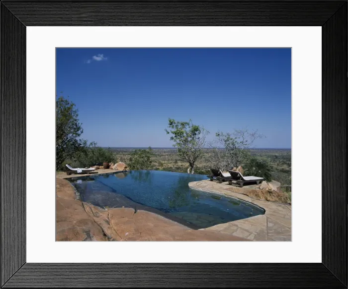 Framed Print : The swimming pool at Elsas Kopje is built into Framed Print : The swimming pool at Elsas Kopje is built into