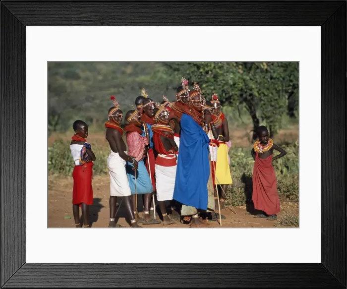 Framed Print : Women watch from the side as warriors sing and dance Framed Print : Women watch from the side as warriors sing and dance