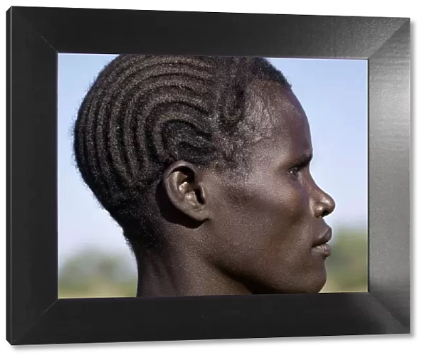 A young Turkana man with a braided hairstyle
