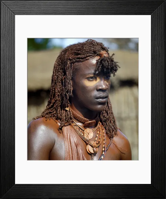 Framed Print : A Msai warrior with his long braids and body coated Framed Print : A Msai warrior with his long braids and body coated