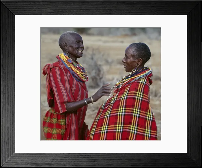Framed Print : Two Msai women in traditional attire chat to each other Framed Print : Two Msai women in traditional attire chat to each other