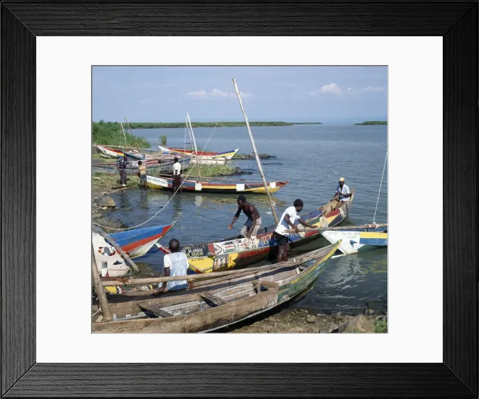 Framed Print : Brightly painted fishing boats of the Luo people find Framed Print : Brightly painted fishing boats of the Luo people find