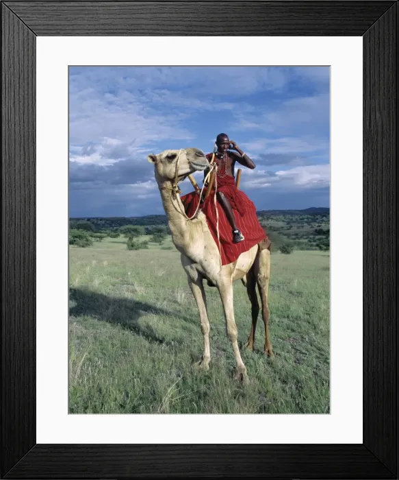 Framed Print : A Msai warrior speaks on his mobile phone from Framed Print : A Msai warrior speaks on his mobile phone from