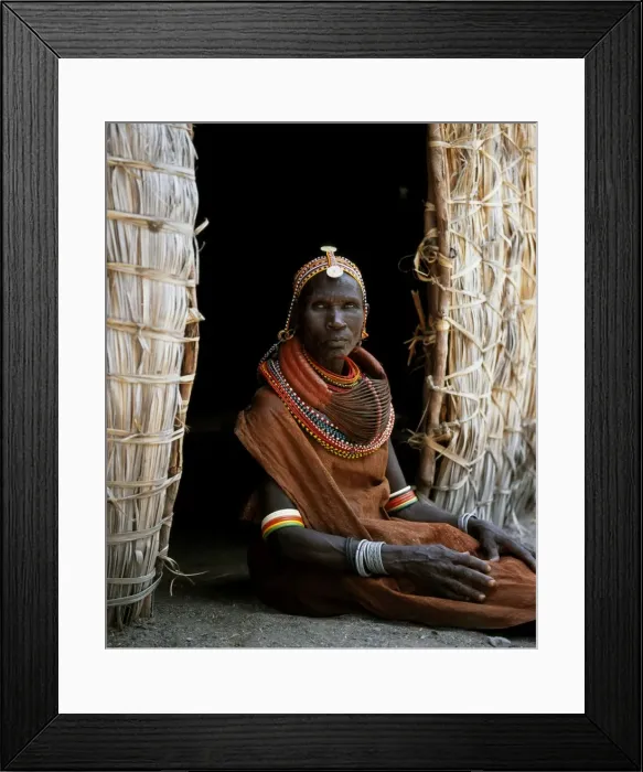 Framed Print : A Turkana woman sitting in the doorway of her hut