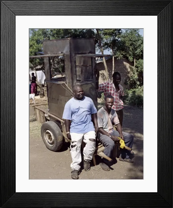 Framed Print : An unfinished mobile phone kiosk is carried on a mkokoteni Framed Print : An unfinished mobile phone kiosk is carried on a mkokoteni