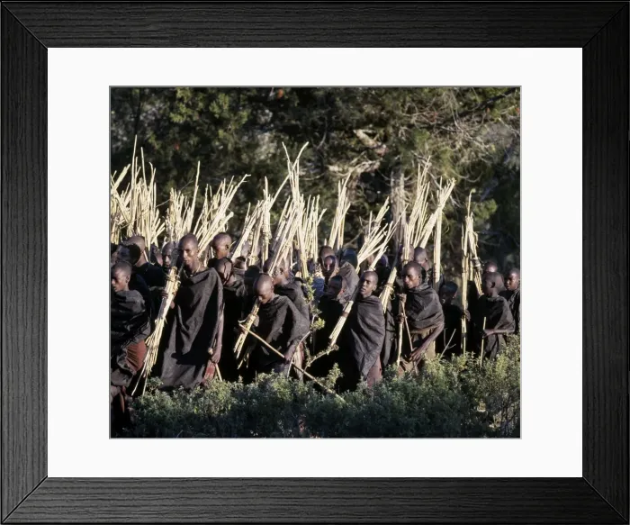 Framed Print : Mothers rub animal fat into their sons cloaks