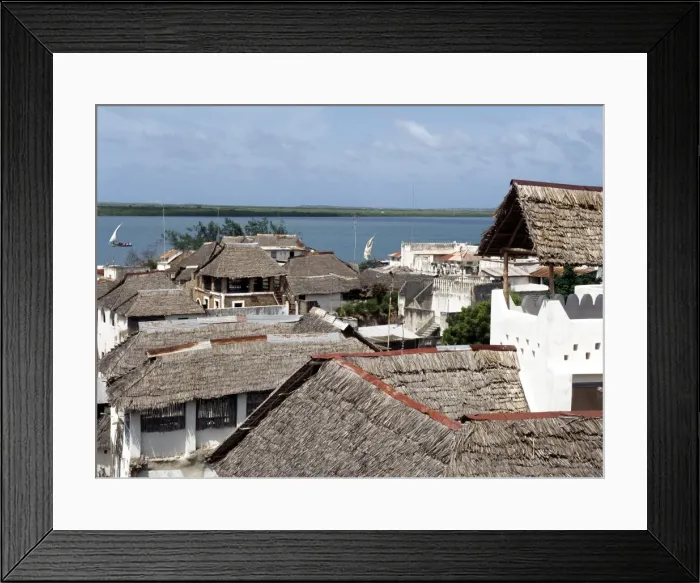 Framed Print : A view over makuti thatched roofs to the estuary that Framed Print : A view over makuti thatched roofs to the estuary that