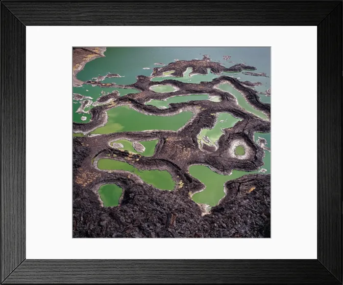 Framed Print : A series of lava rock pools are situated just off Framed Print : A series of lava rock pools are situated just off