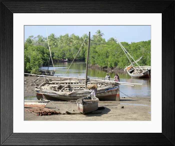 Framed Print : Wooden sailing boats anchor at the end of the mangrove-lined Framed Print : Wooden sailing boats anchor at the end of the mangrove-lined