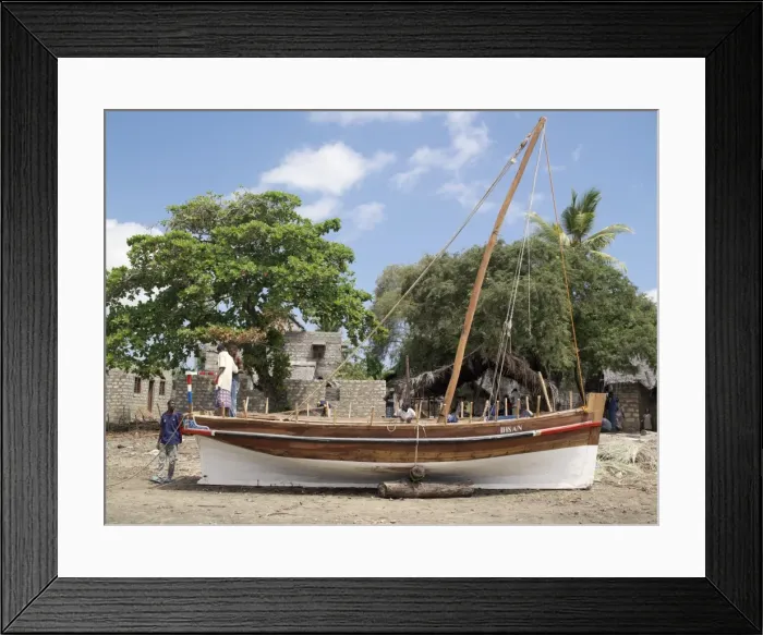 Framed Print : Boat builders put the finishing touches to a new jahazi Framed Print : Boat builders put the finishing touches to a new jahazi