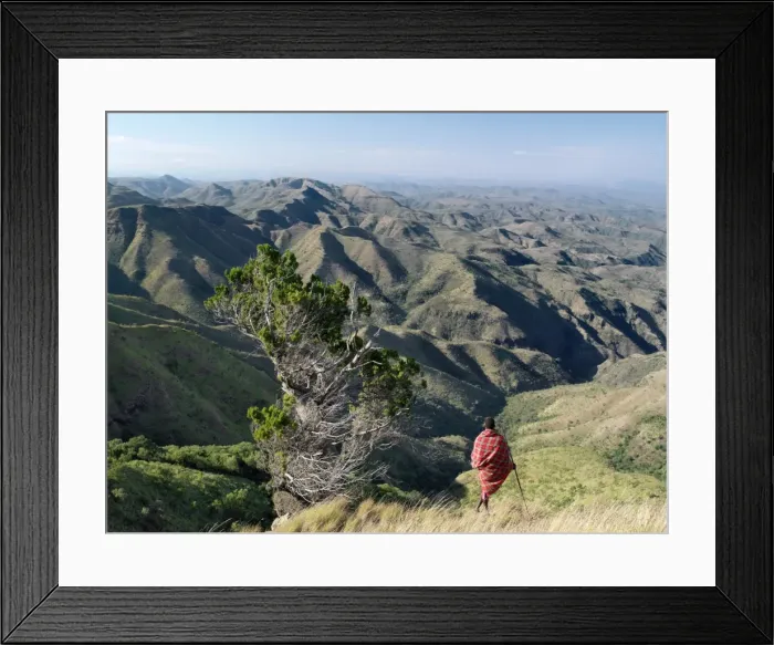 Framed Print : A Samburu warrior looks out over a vast expanse of Framed Print : A Samburu warrior looks out over a vast expanse of