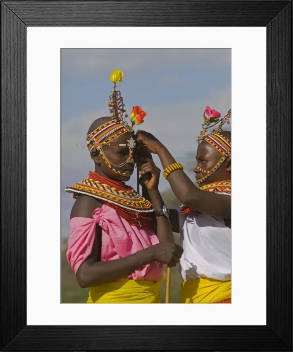 Framed Print : Two young Samburu girls help each other preparing for a celebration Framed Print : Two young Samburu girls help each other preparing for a celebration
