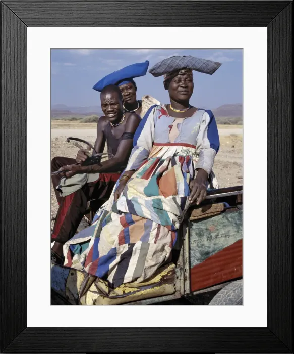 Framed Print : An Herero man and two women ride home in a donkey cart Framed Print : An Herero man and two women ride home in a donkey cart