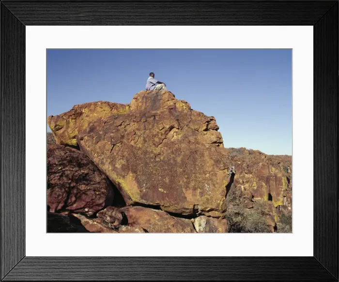Framed Print : Beautiful red sandstone cliffs surround the isolated Framed Print : Beautiful red sandstone cliffs surround the isolated