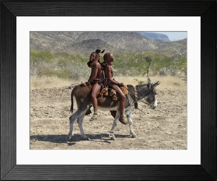 Framed Print : Two happy Himba girls ride a donkey to market Framed Print : Two happy Himba girls ride a donkey to market