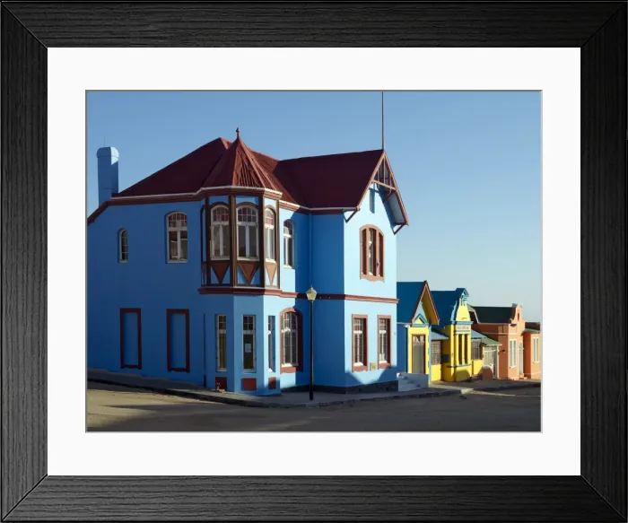 Framed Print : A street of well preserved German colonial houses in Luderitz Framed Print : A street of well preserved German colonial houses in Luderitz