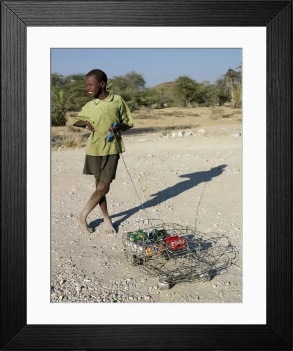 Framed Print : A happy youth with his ingenious homemade wire lorry Framed Print : A happy youth with his ingenious homemade wire lorry