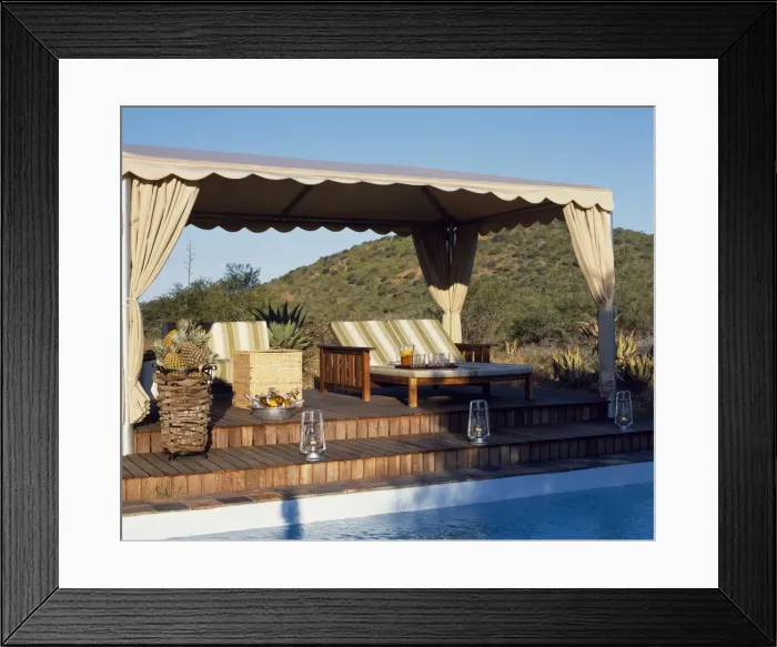 Framed Print : Sun loungers on a canopied deck beside the swimming pool at Uplands Homestead Framed Print : Sun loungers on a canopied deck beside the swimming pool at Uplands Homestead